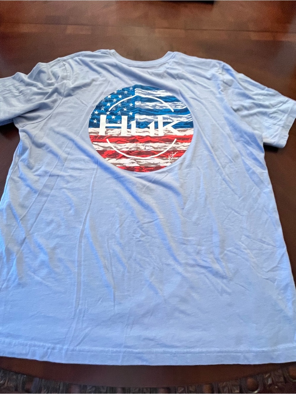 Huk brand Light Blue Short Sleeve Tee with American Flag Circle Logo